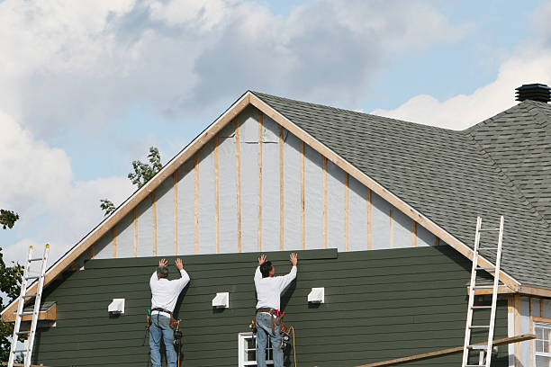 Professional Storm Damage Siding Repair technician working in Paoli, IN